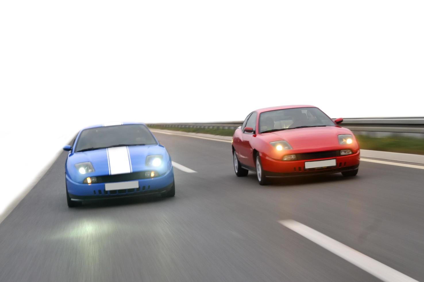 Isolated tuning cars racing on highway photo