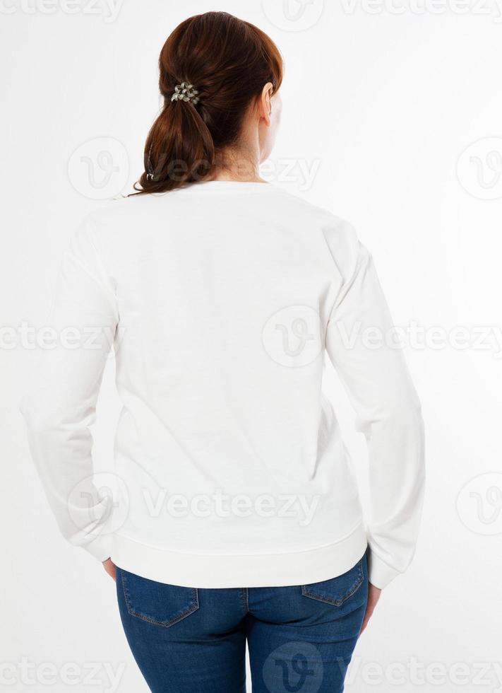 woman in white pullover posing on white background - back view photo