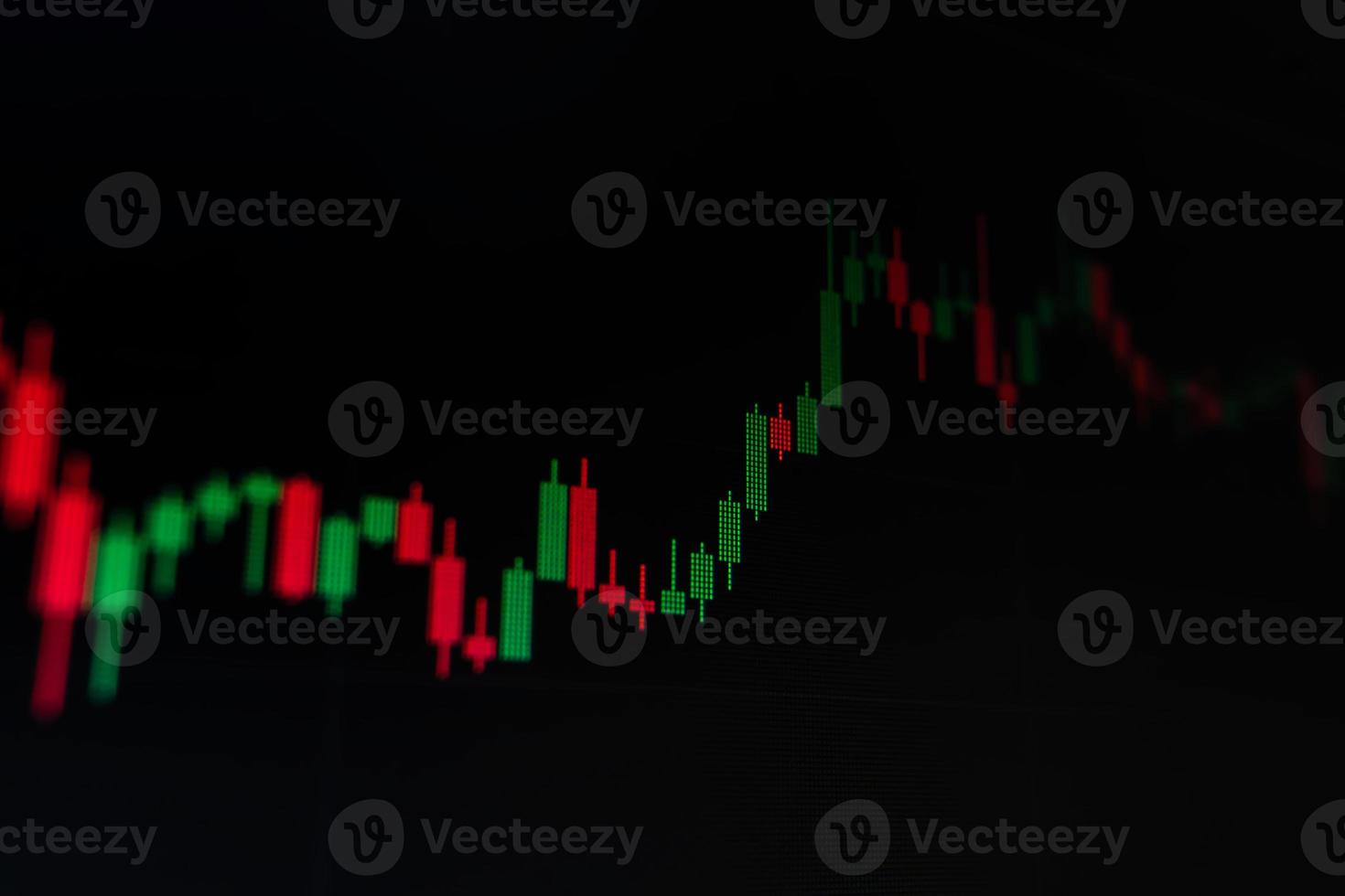 graficar el comercio de acciones en un fondo negro del monitor. foto