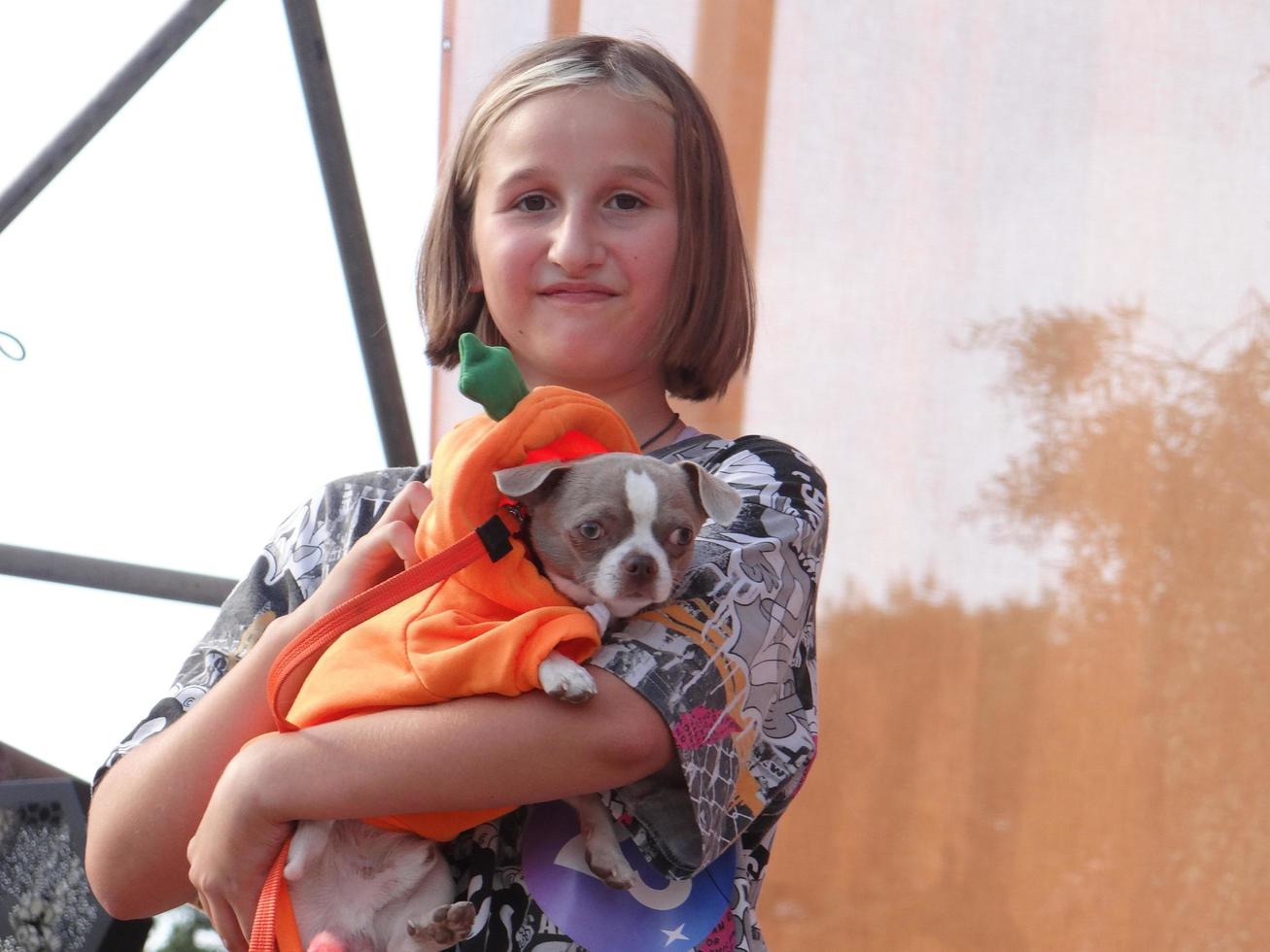 St Petersburg, Russia, 2022 - Dogs dressed up for the fashion show at Petshop Days festival photo