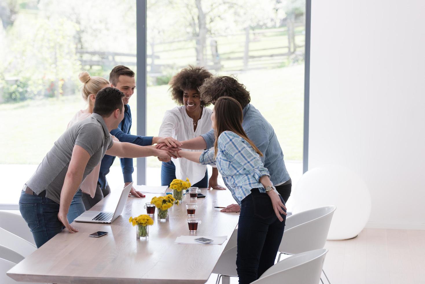 multiethnic startup Group of young business people celebrating success photo