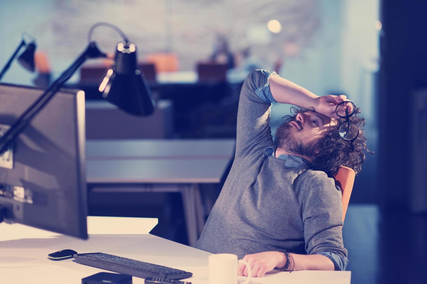 businessman relaxing at the desk photo
