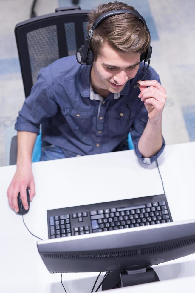 male call centre operator doing his job top view photo