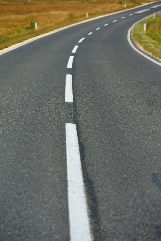 road through the green field photo