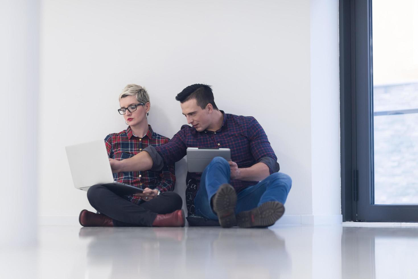 startup business, couple working on laptop computer at office photo
