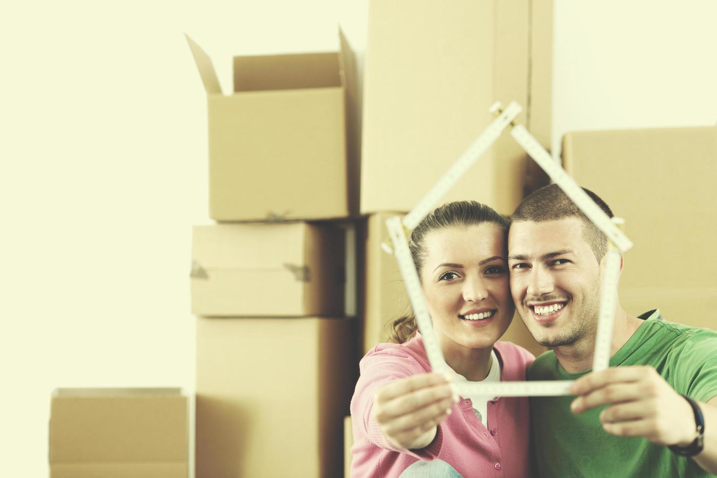 Young couple moving in new house photo