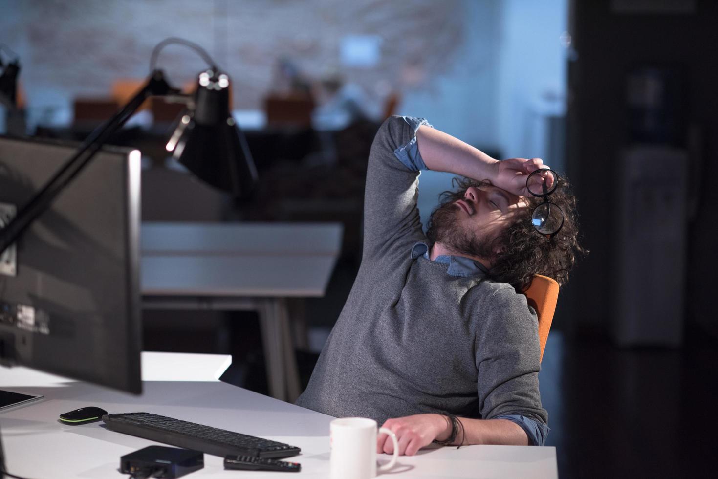 businessman relaxing at the desk photo