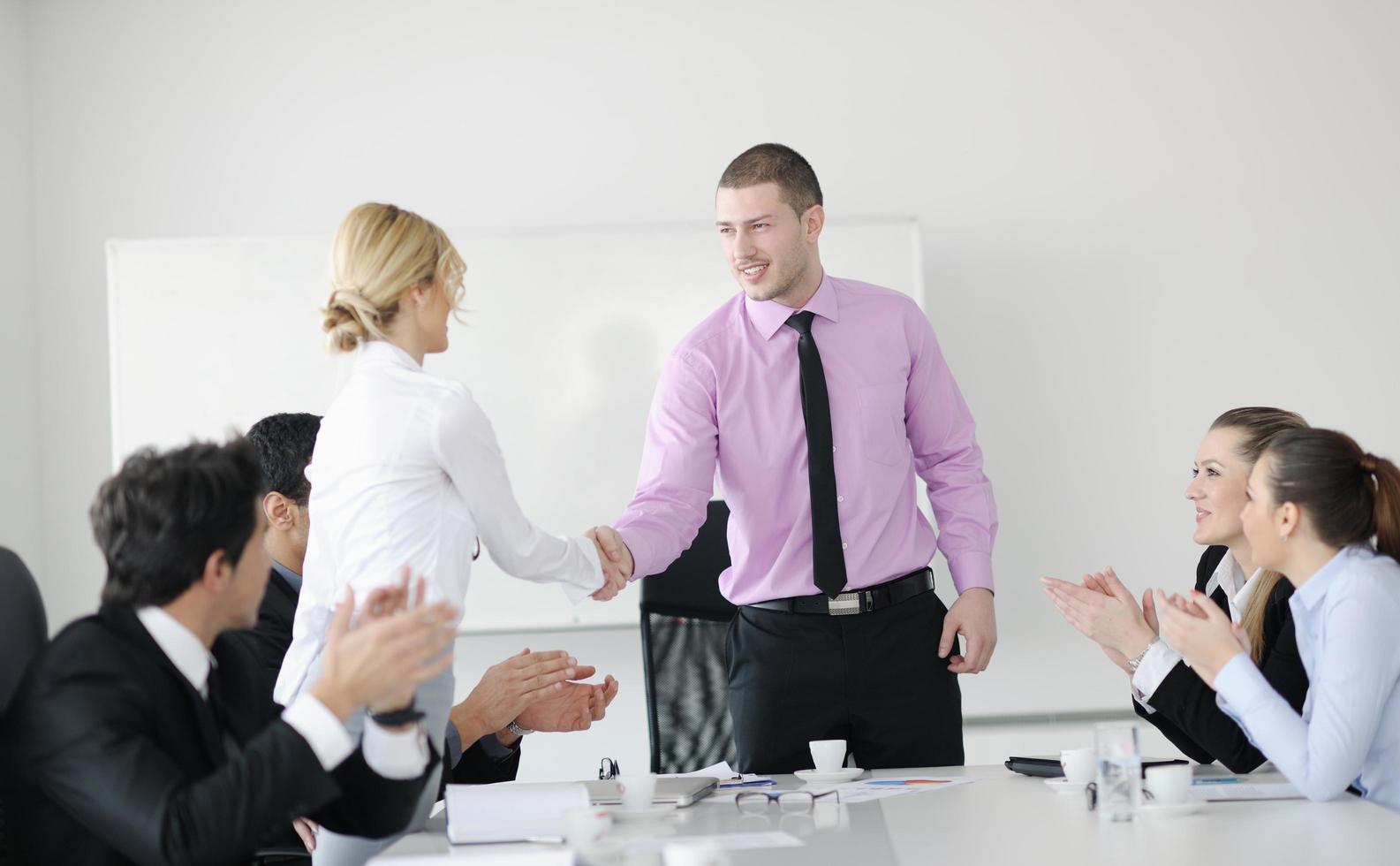 Group of young business people at meeting photo