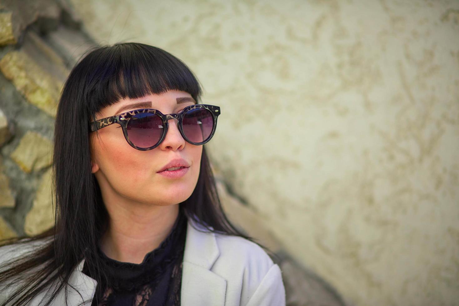 Beautiful young girl with black hair, sunglasses. Youth, happiness, summer sunny day, portrait photo