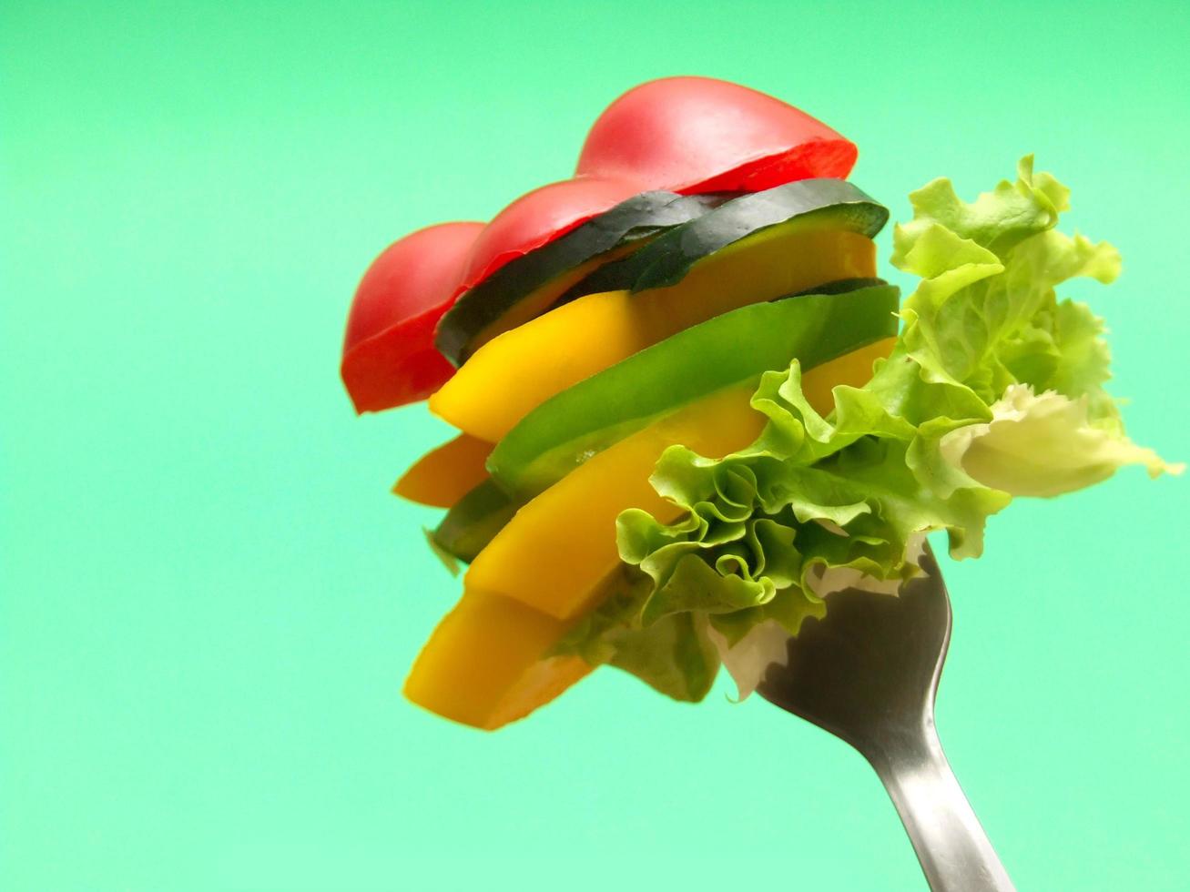 sliced vegetables on fork... photo