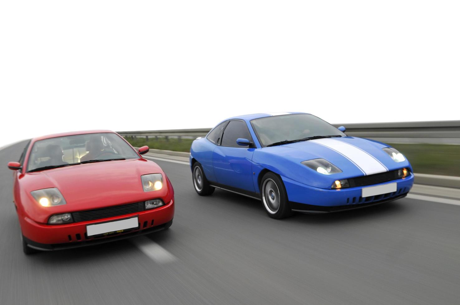 Isolated tuning cars racing on highway photo