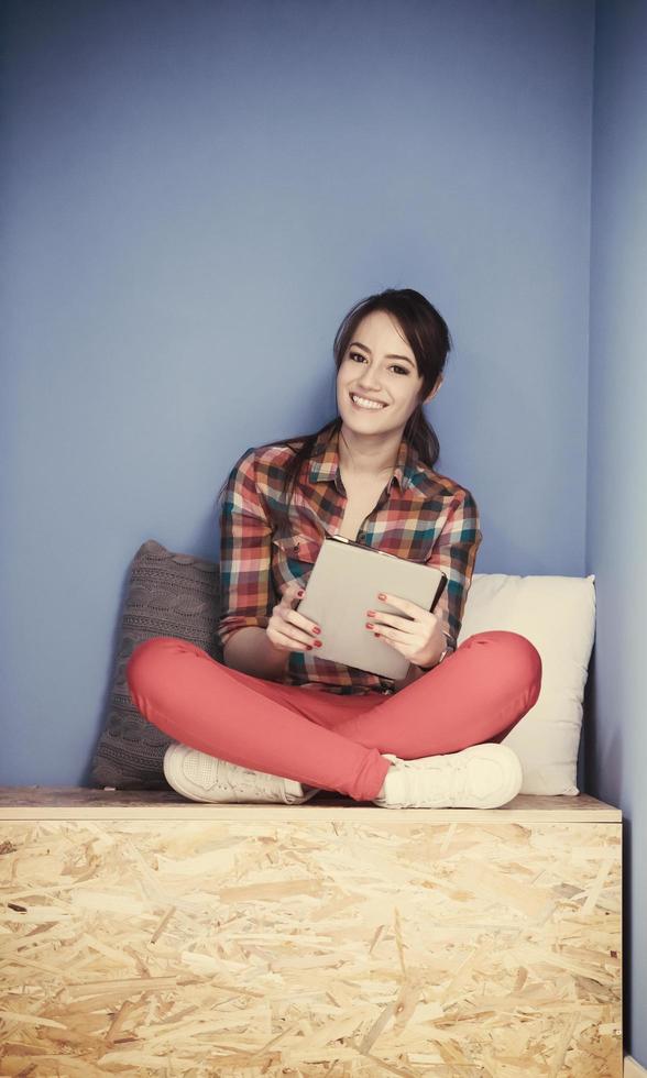 woman in crative box working on tablet photo