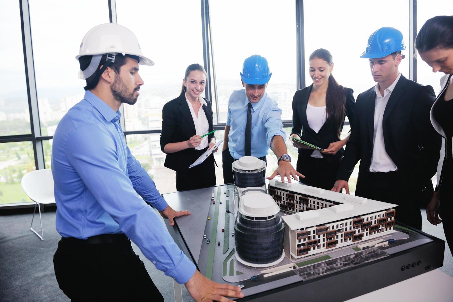 business people and engineers on meeting photo