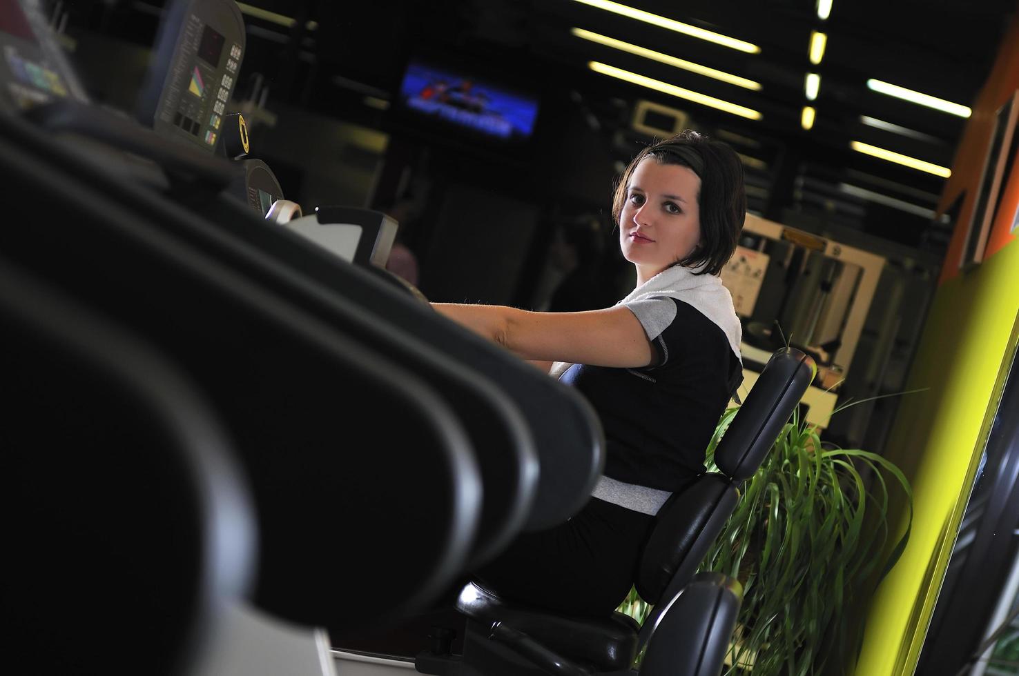 Young woman working out in gym photo