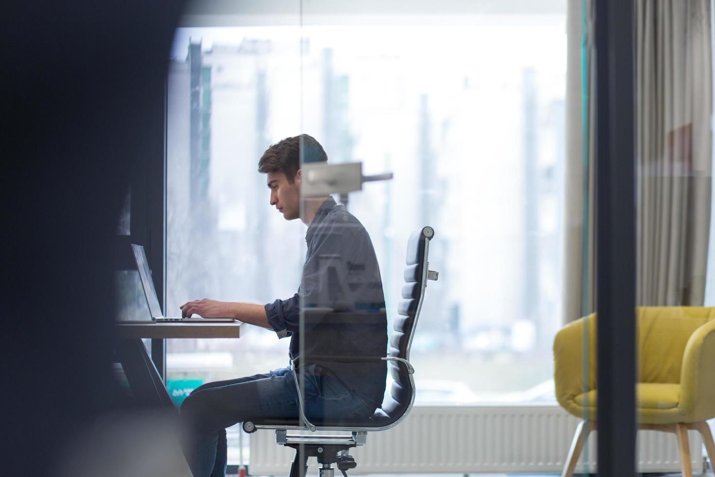 businessman working using a laptop in startup office photo