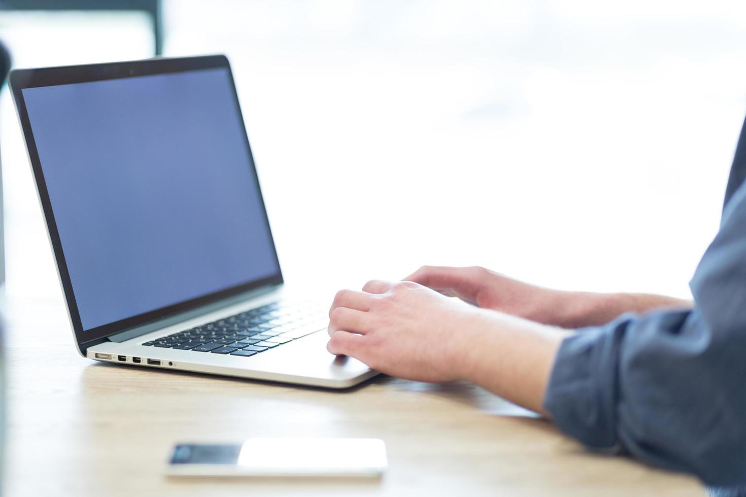 businessman working using a laptop in startup office photo