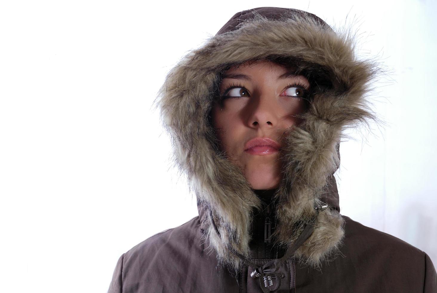 Cute young woman smiling in winter jacket photo