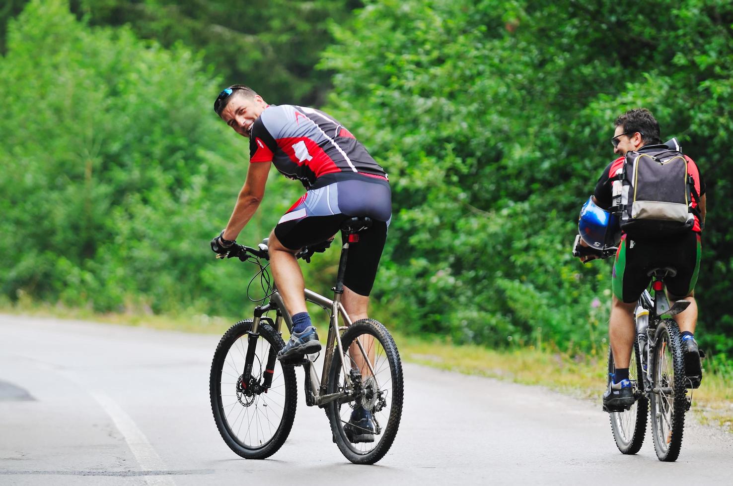 friendship and travel on mountain bike photo