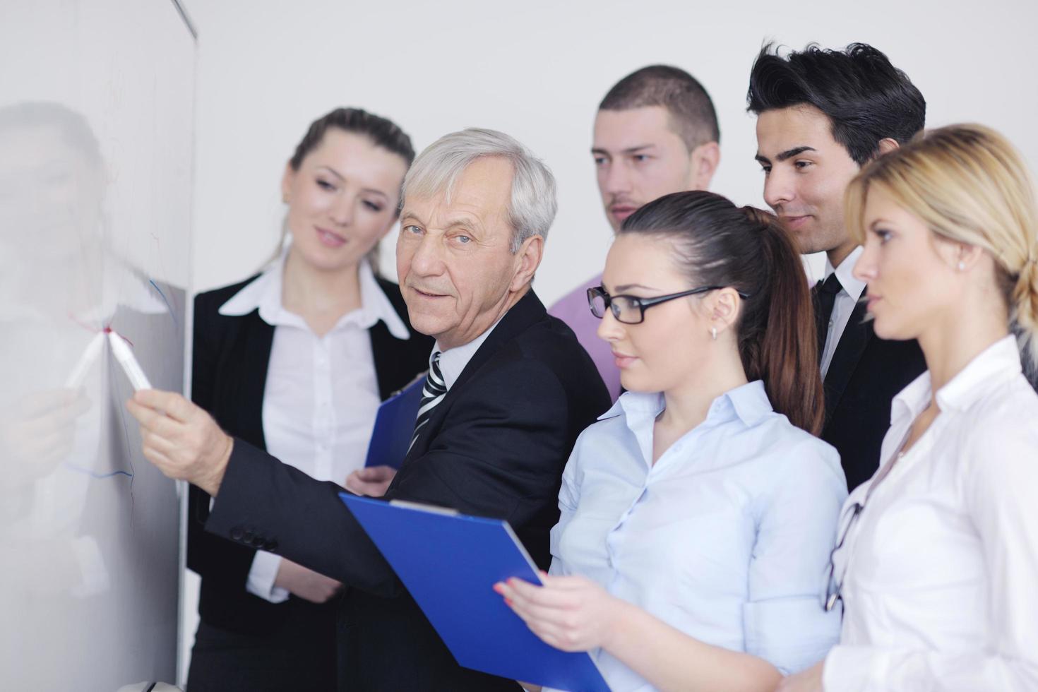 Senior business man giving a presentation photo