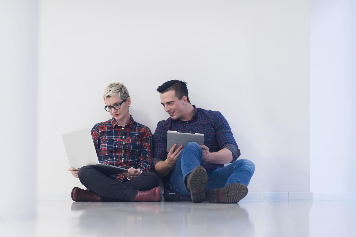 startup business, couple working on laptop computer at office photo