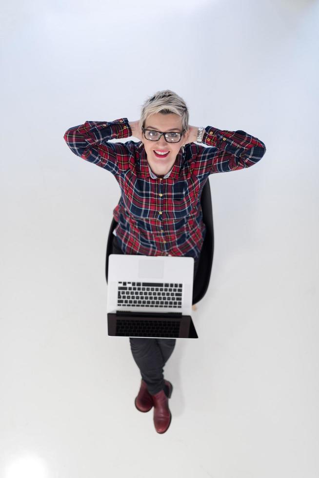 top view of young business woman working on laptop computer photo