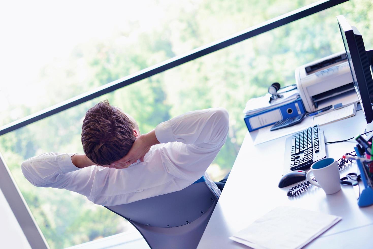 happy young business man at office photo