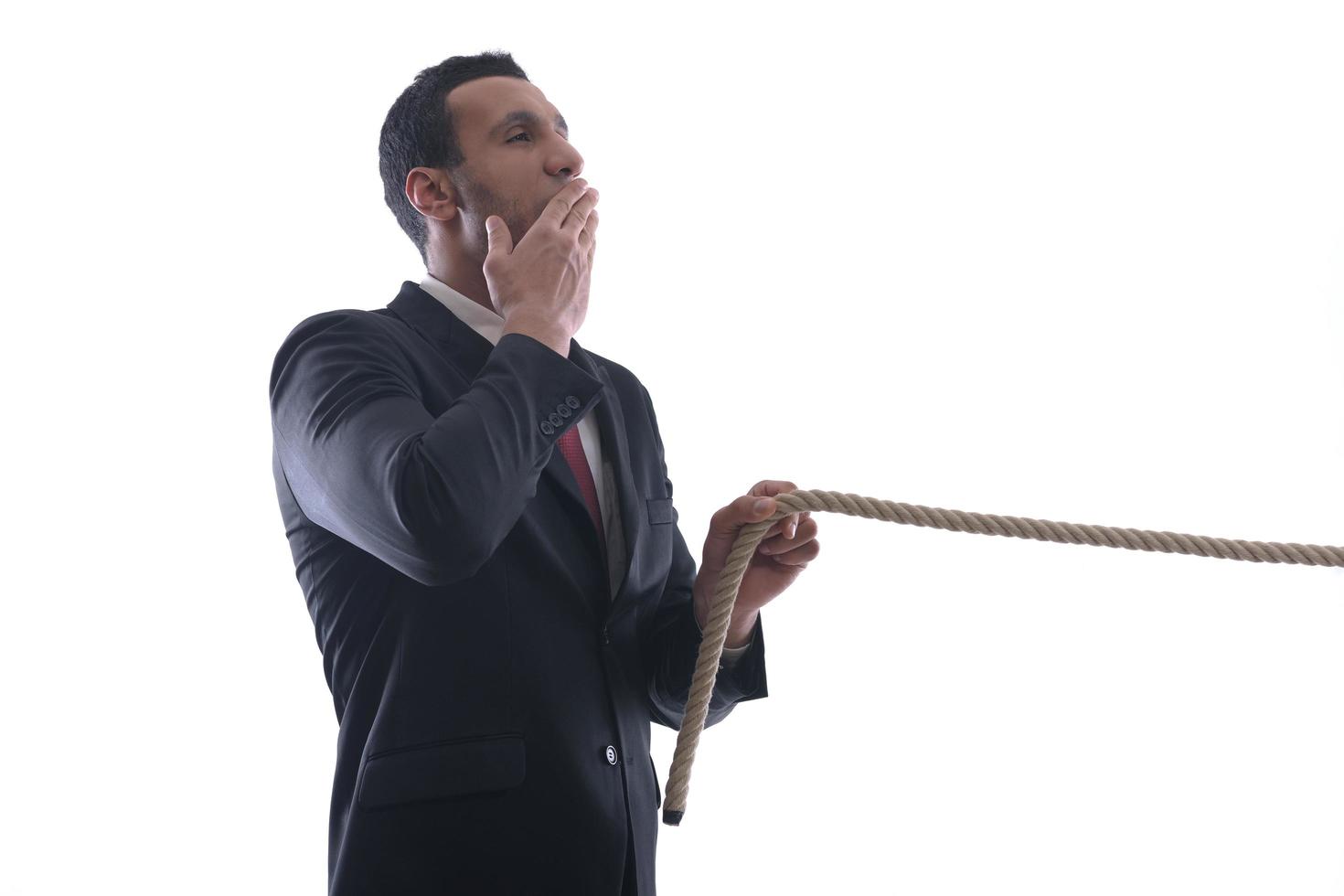 business man with rope isolated on white background photo