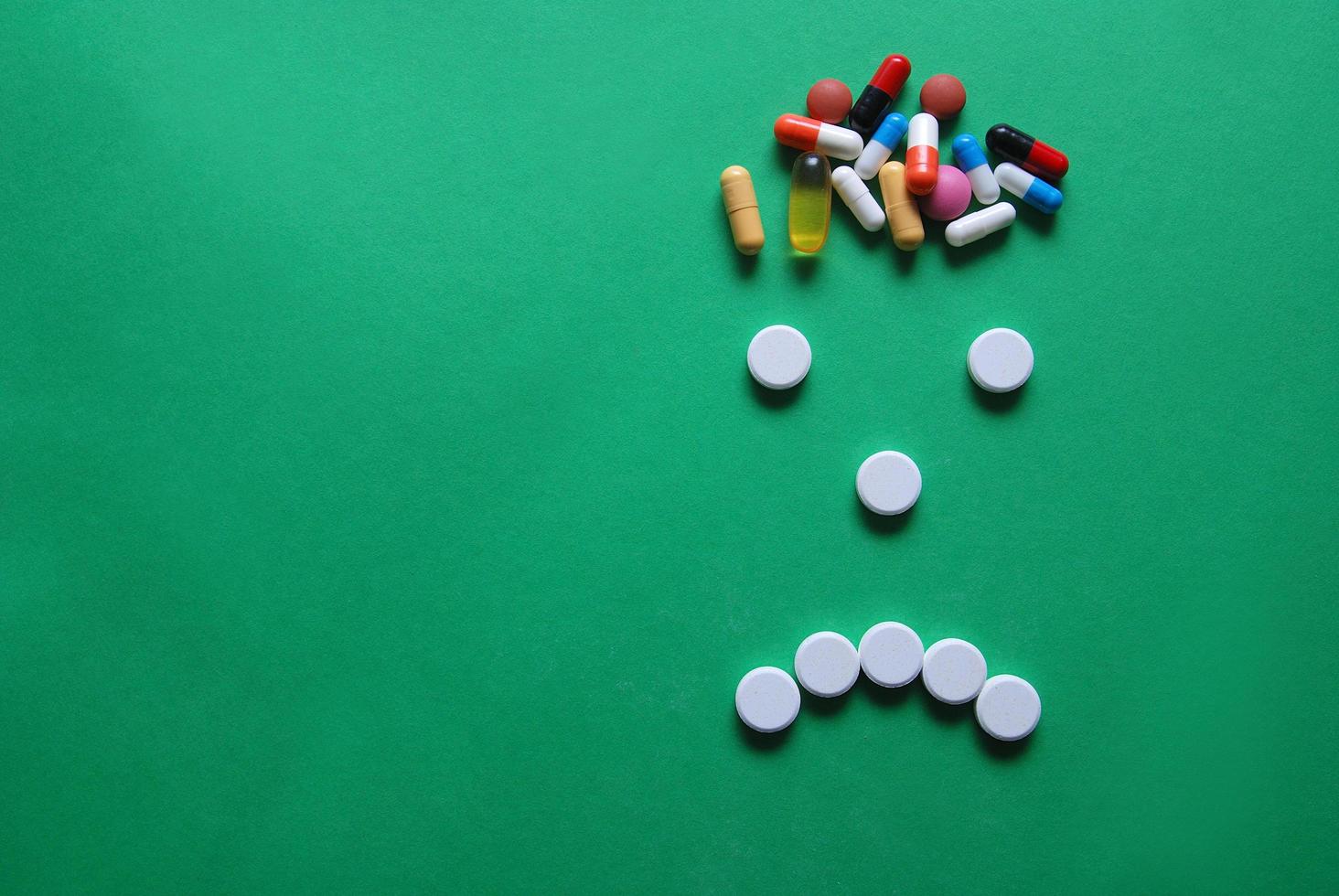 headache caricature with pills photo