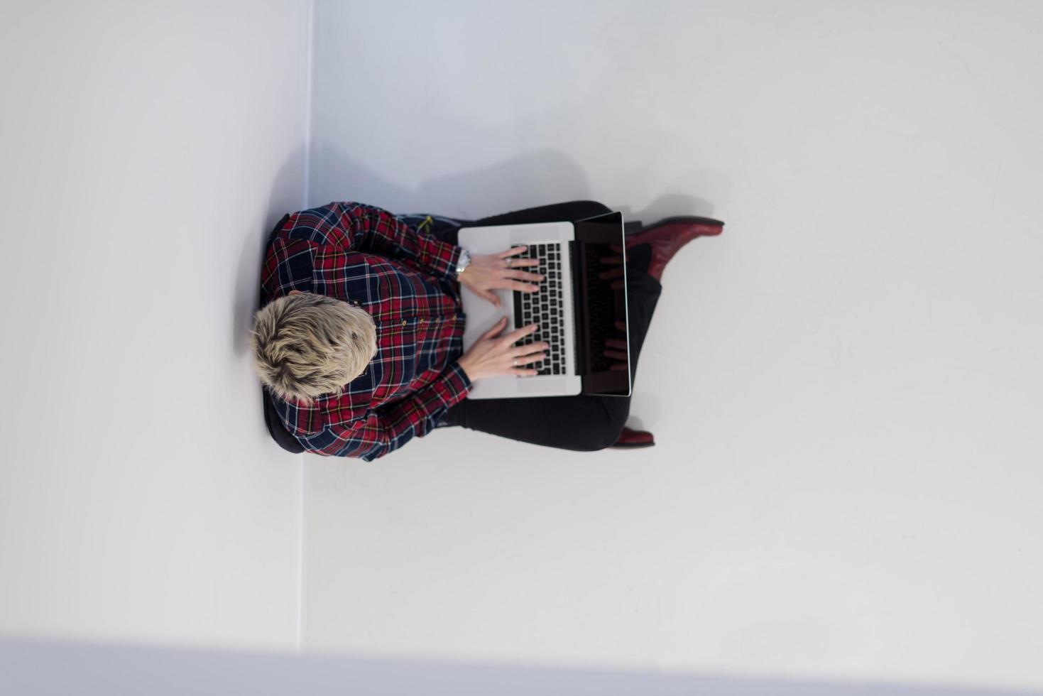 top view of young business woman working on laptop computer photo