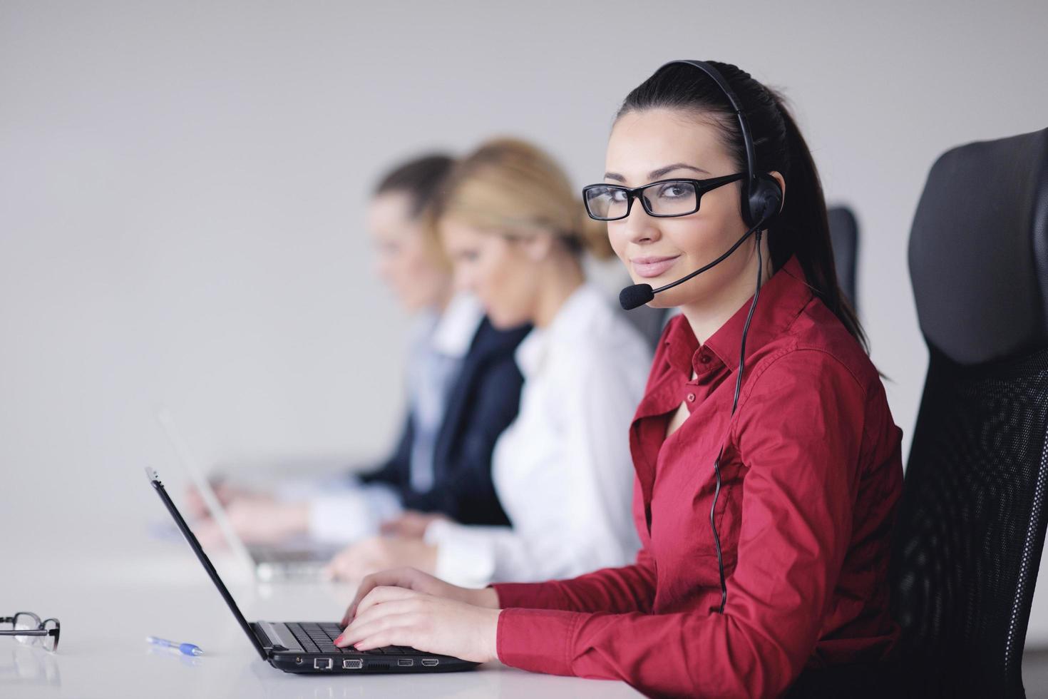 business woman group with headphones photo