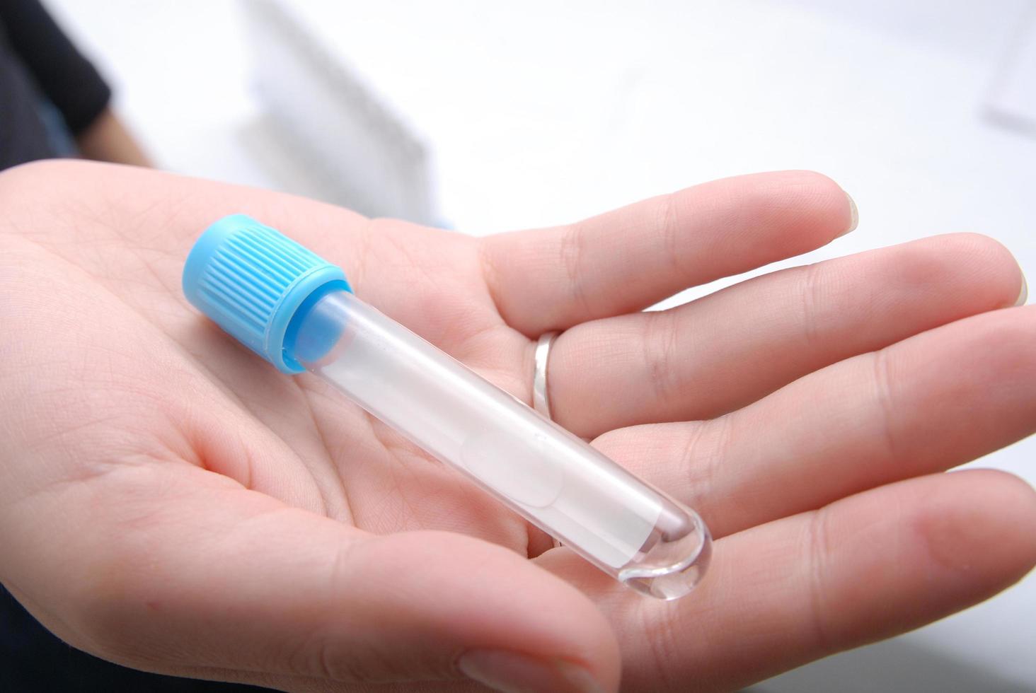 test-tube in woman hand photo