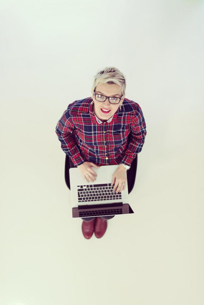 top view of young business woman working on laptop computer photo