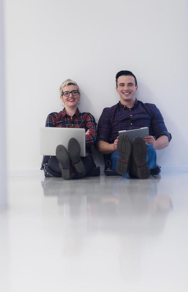 startup business, couple working on laptop computer at office photo