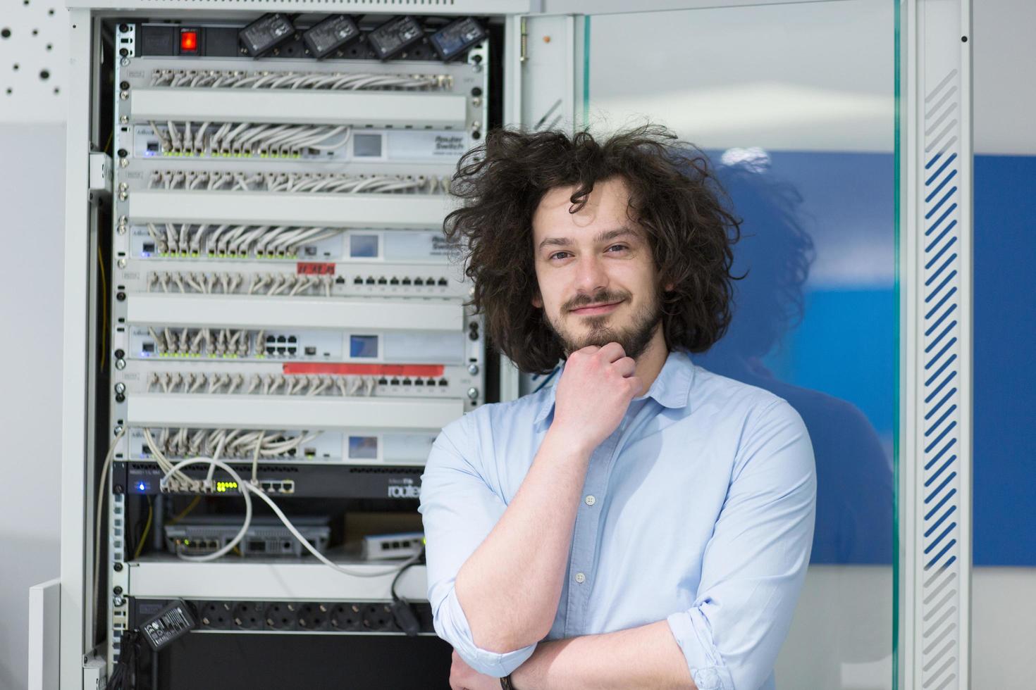 business man engeneer in datacenter server room photo