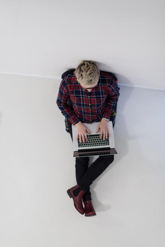 top view of young business woman working on laptop computer photo