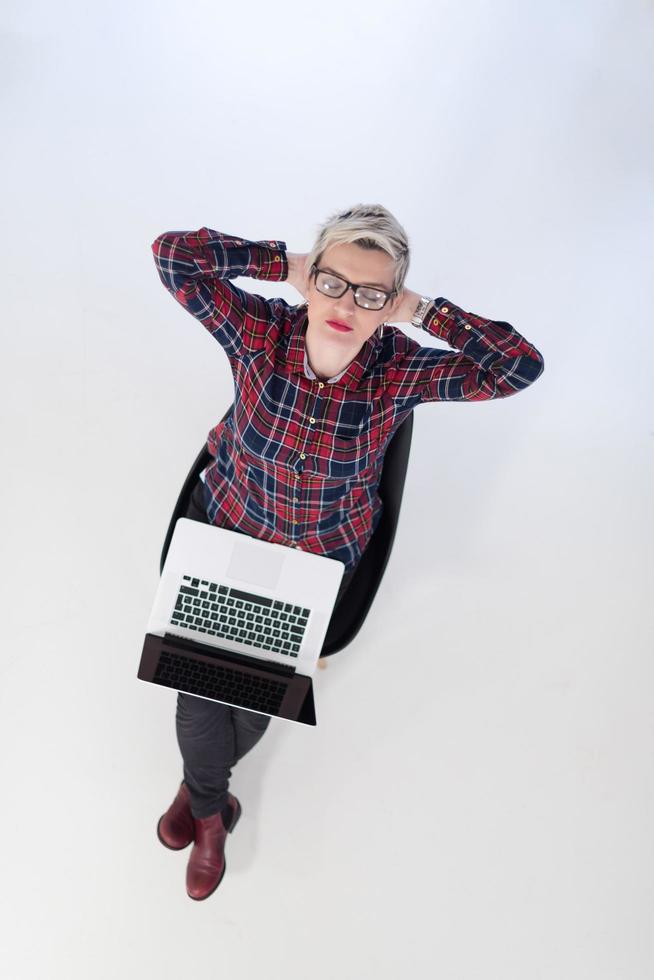 top view of young business woman working on laptop computer photo