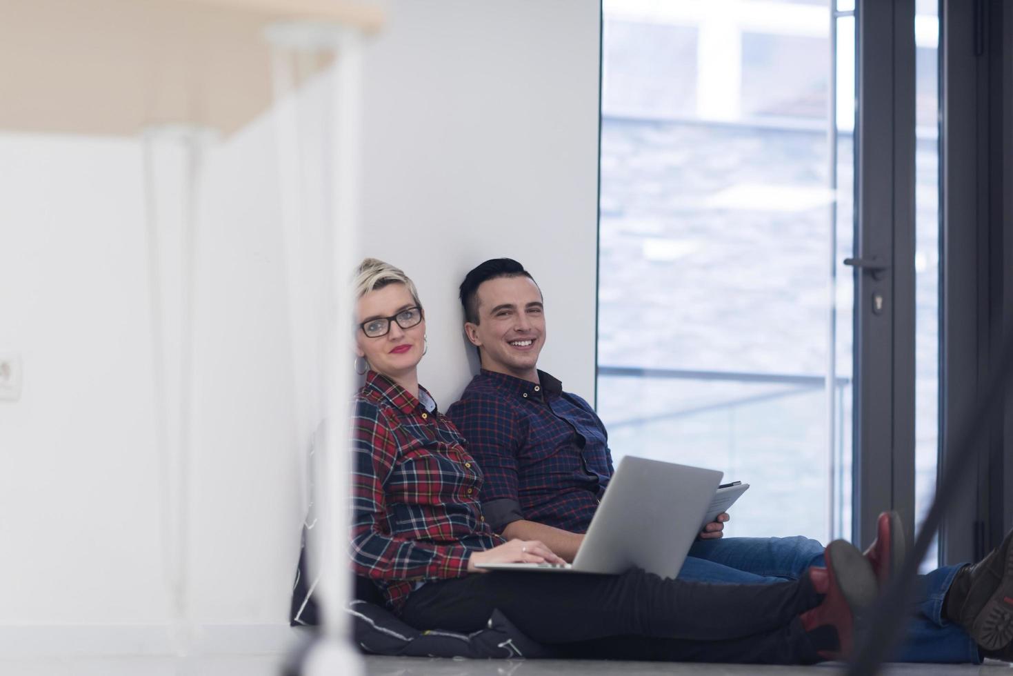 startup business, couple working on laptop computer at office photo