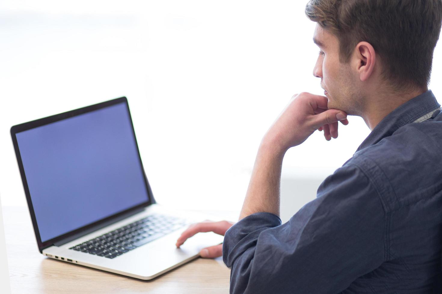 businessman working using a laptop in startup office photo