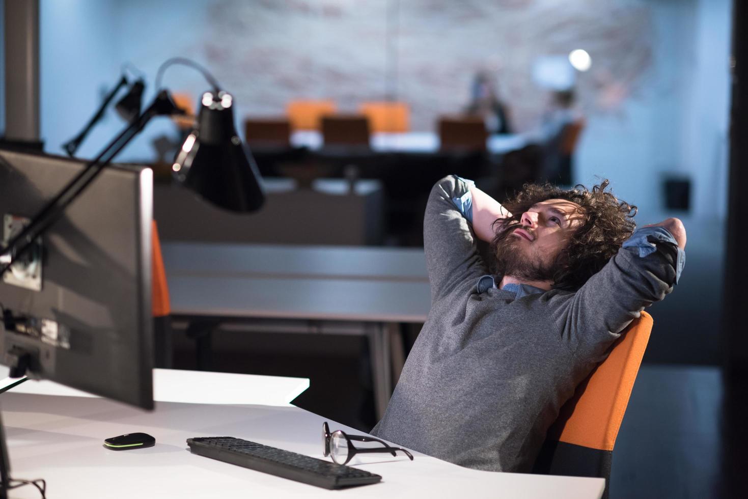 businessman relaxing at the desk photo