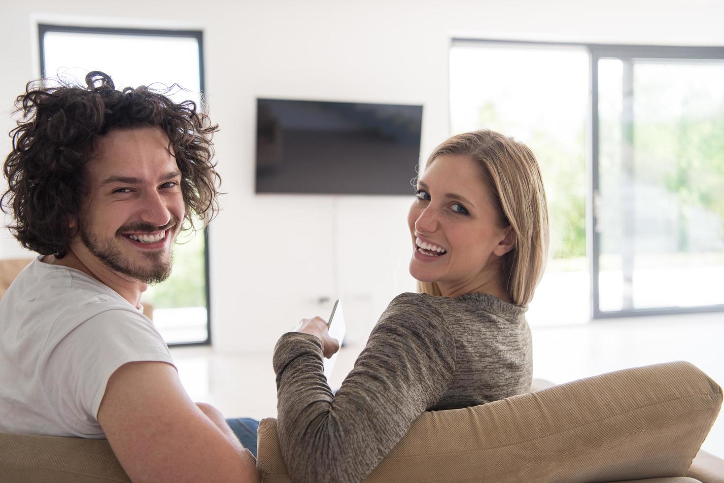 Rear view of couple watching television photo