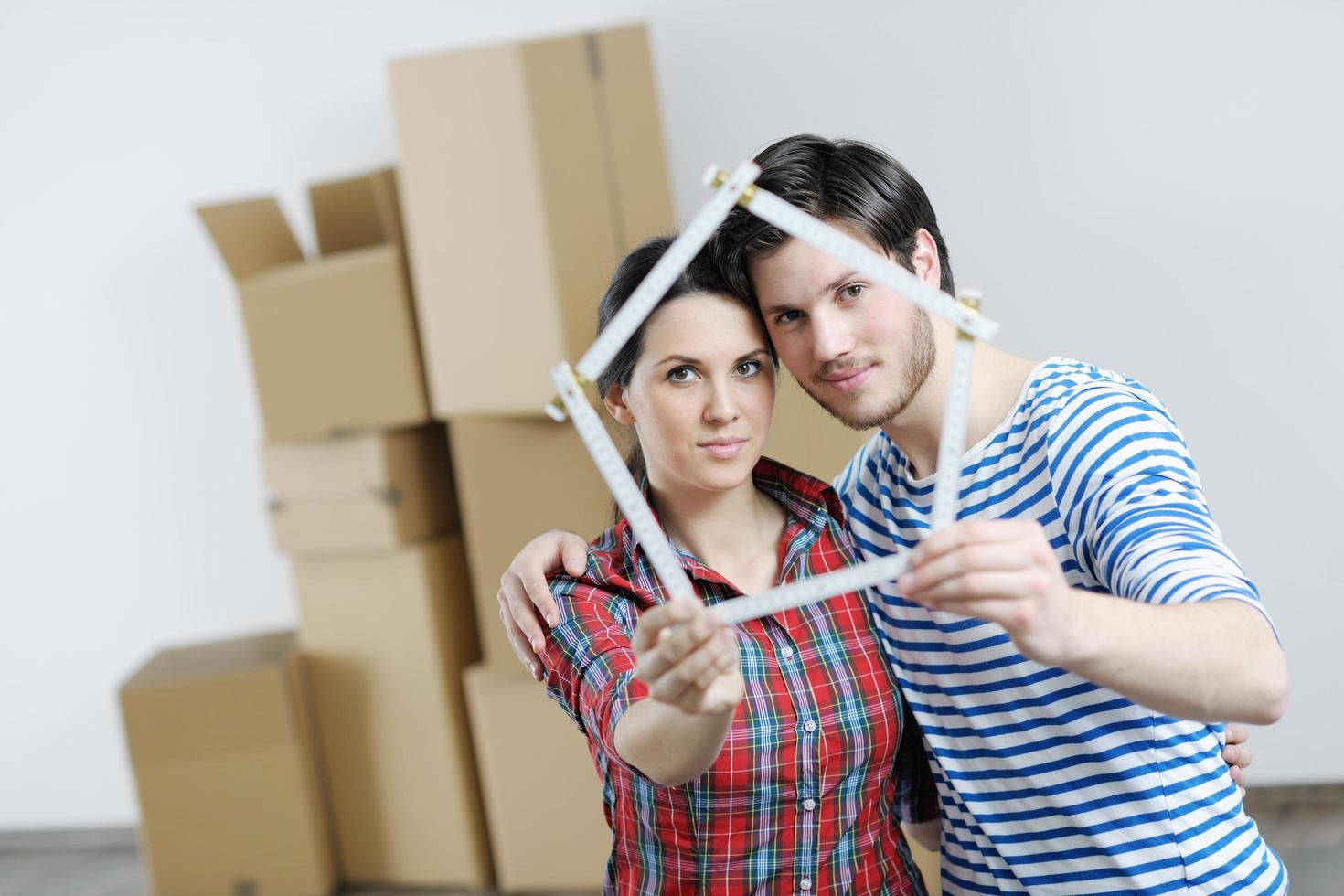 Young couple moving in new house photo