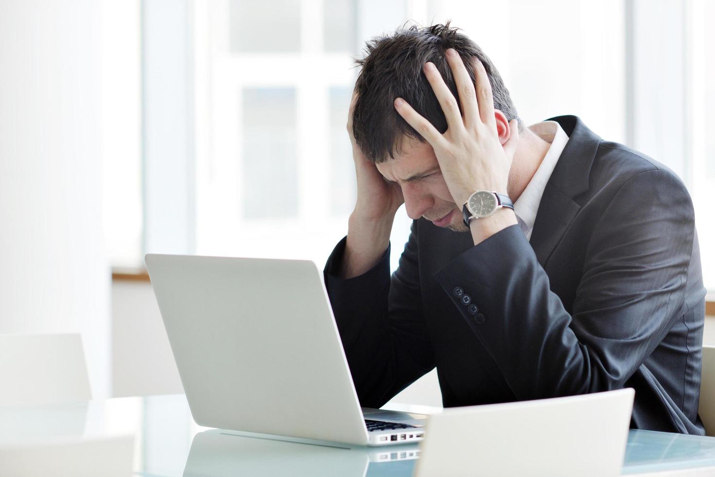 young business man alone in conference room photo