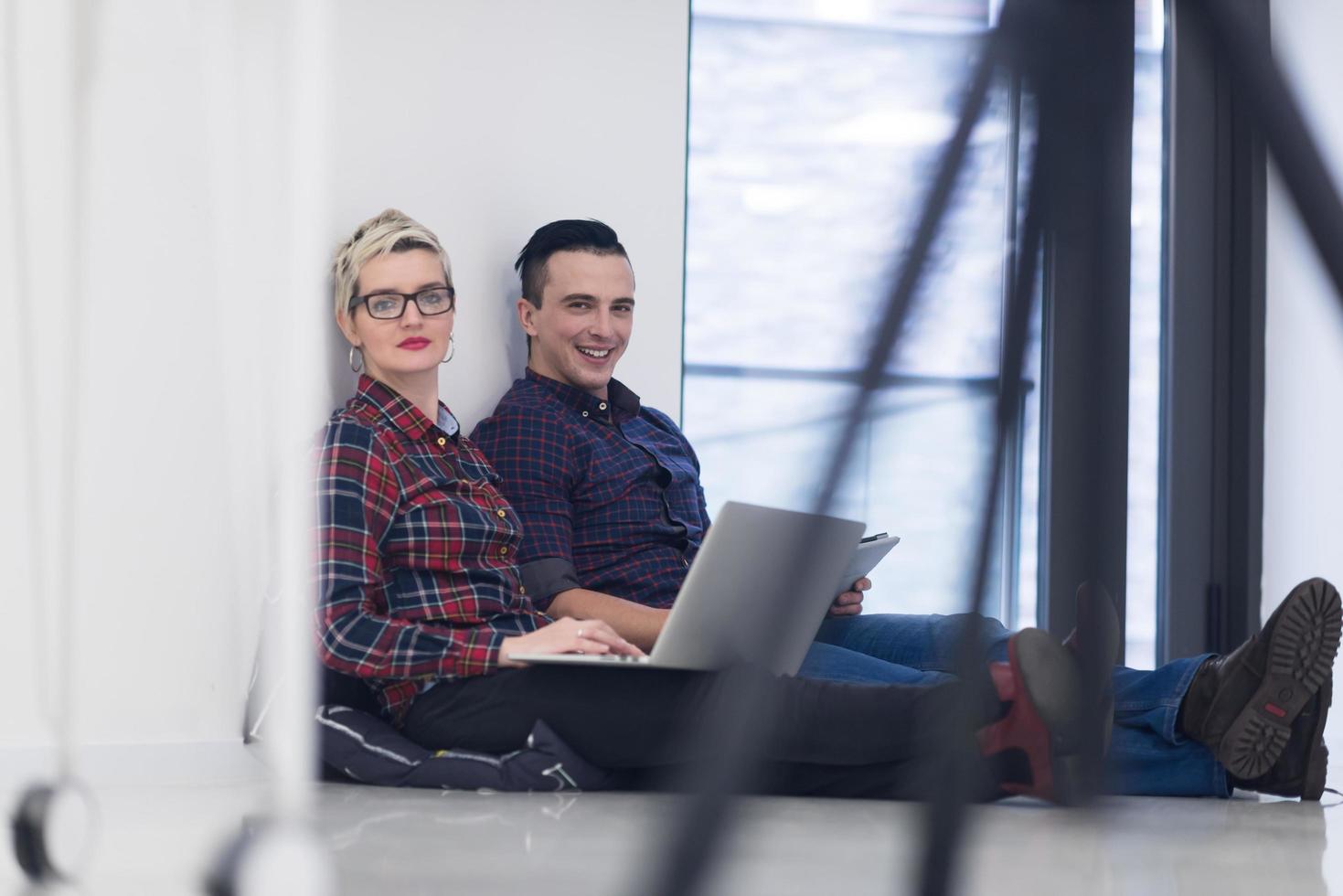 startup business, couple working on laptop computer at office photo