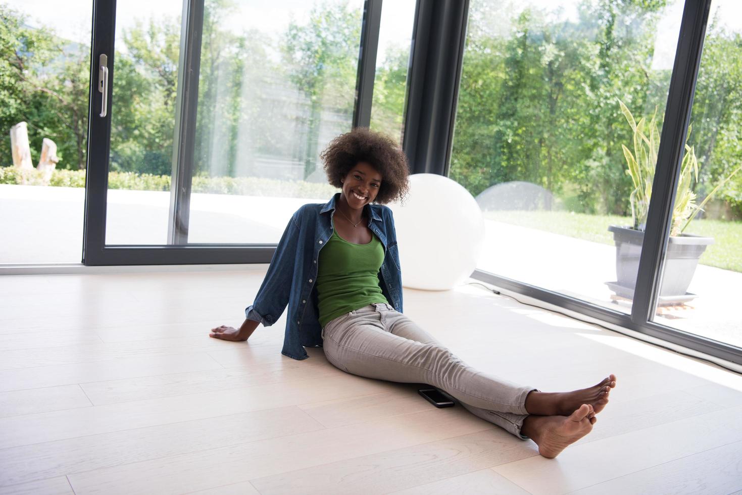 african american  woman  sitting near window photo