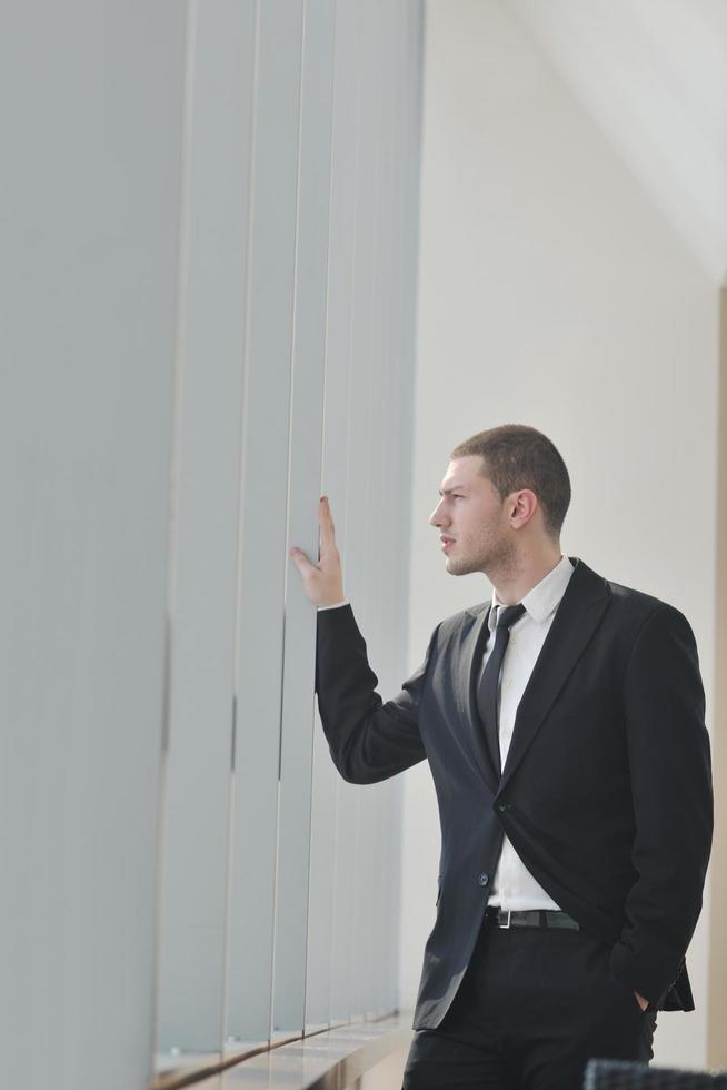 young business man alone in conference room photo