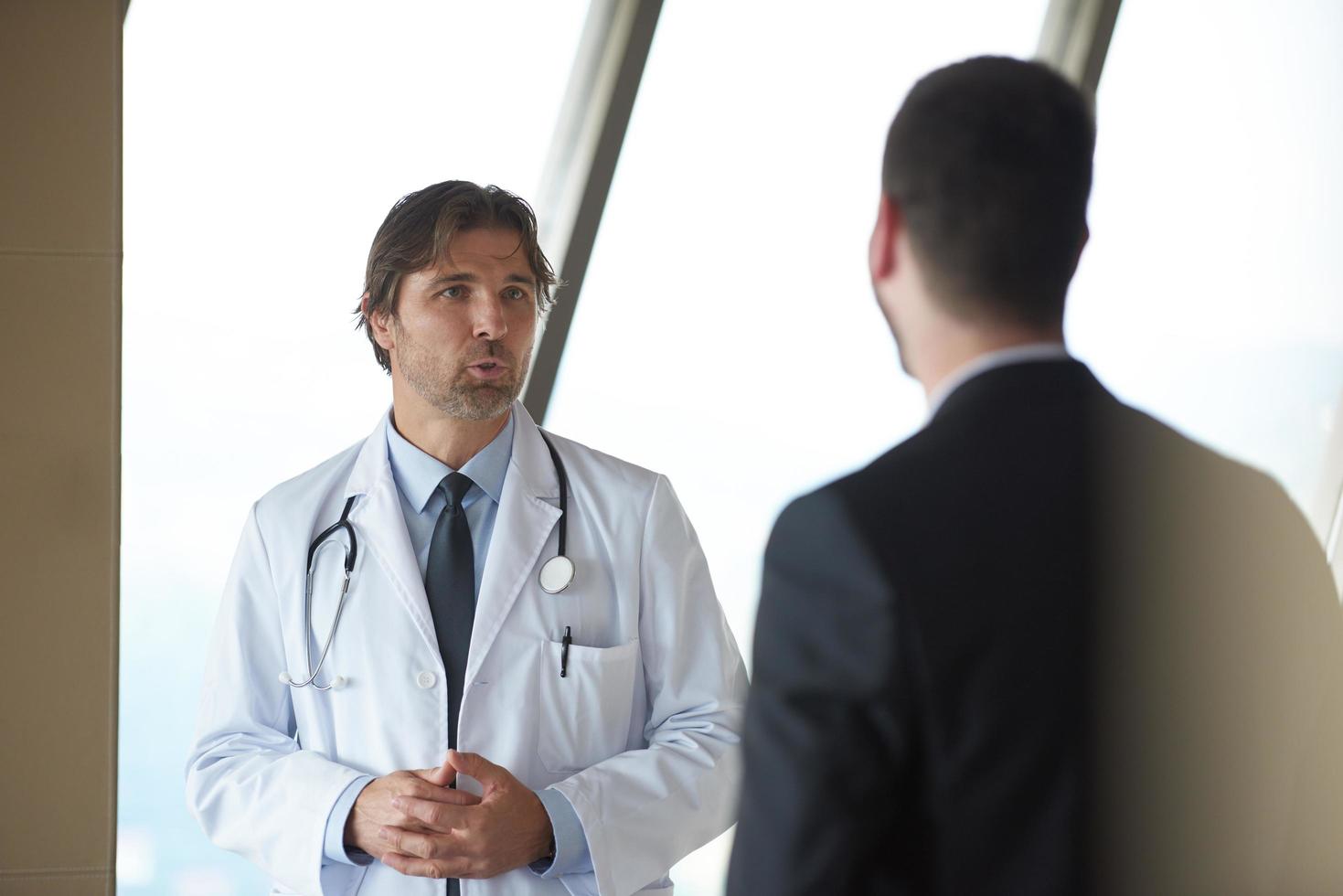 doctor handshake with a patient photo