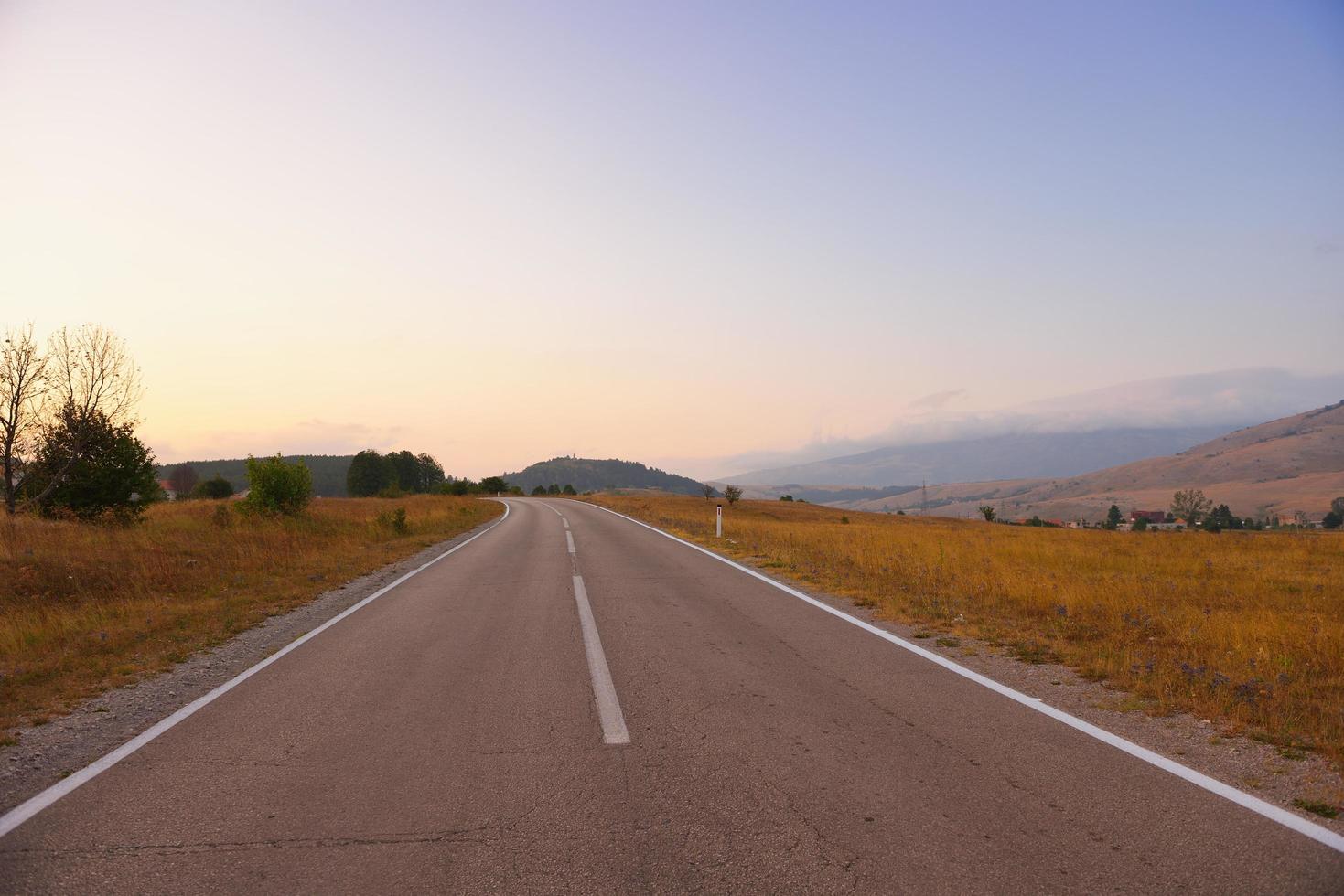 road through the green field photo
