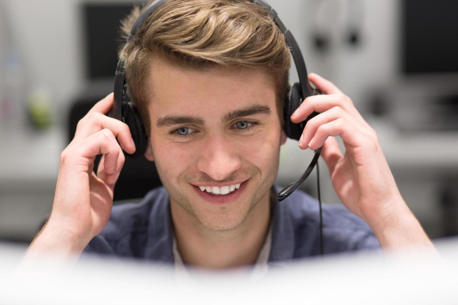male call centre operator doing his job photo