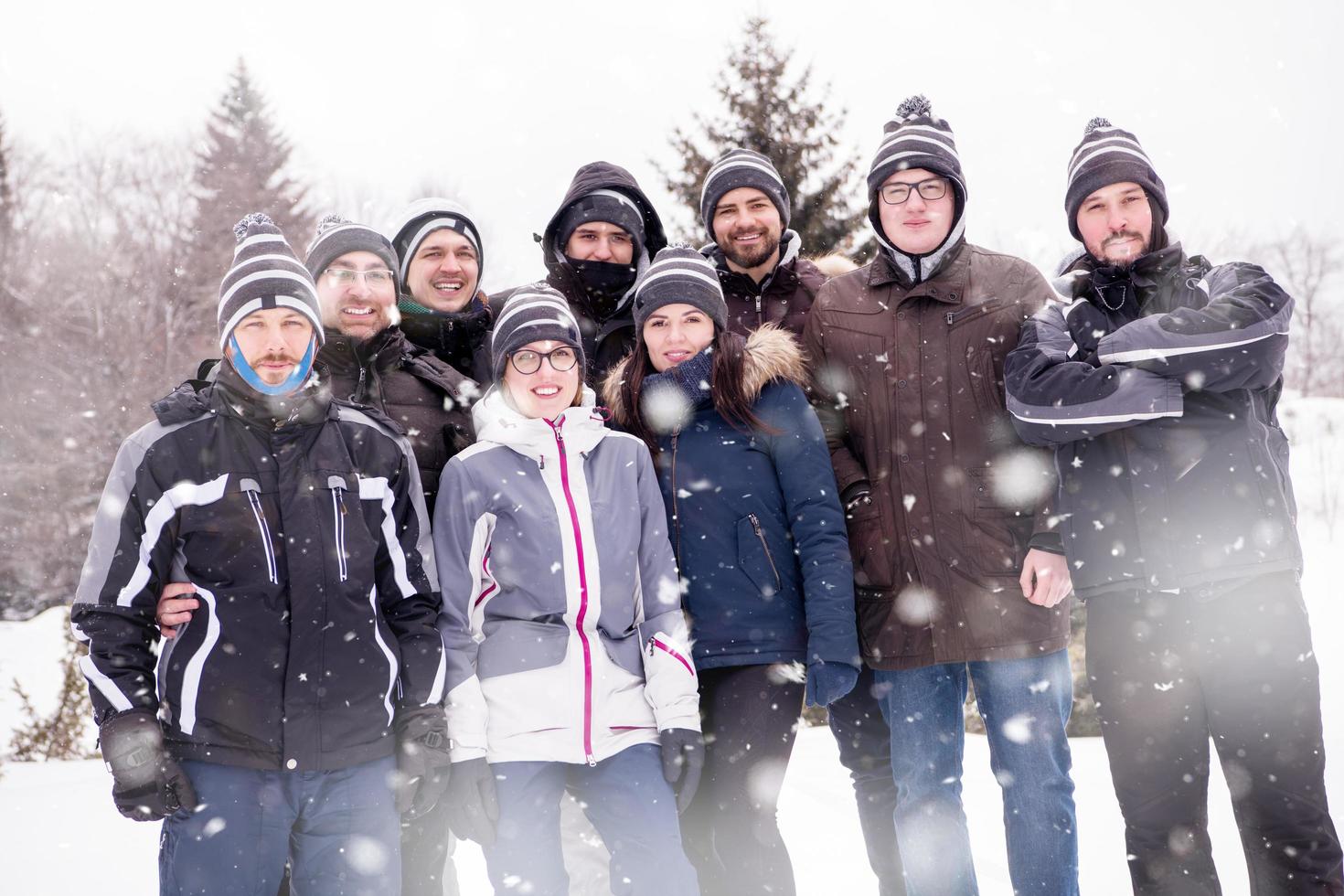 portrait of group young people in beautiful winter landscape photo