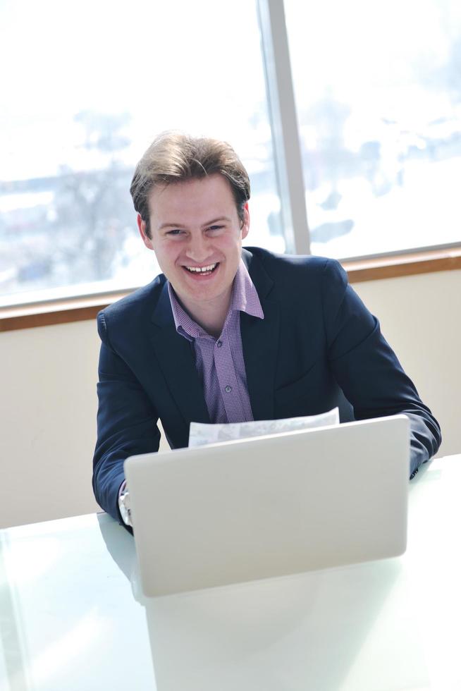 young business man alone in conference room photo